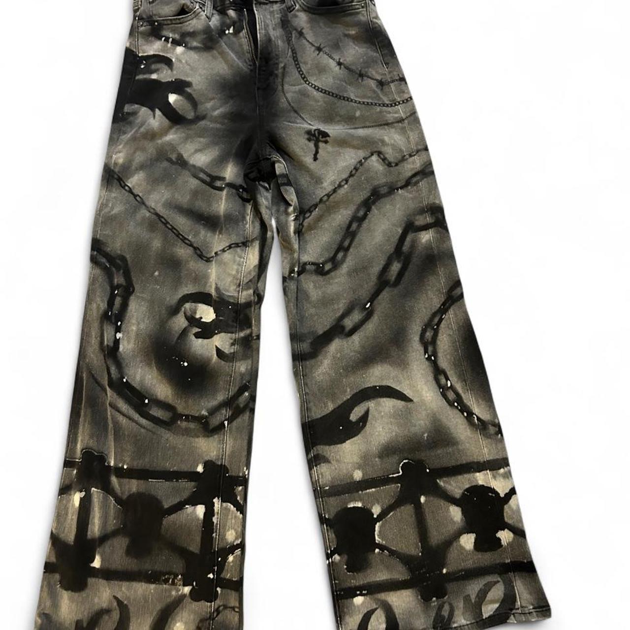 Original N Titled Depop photograph of black and gray jeans with chain-link and bleach-dyed graphics